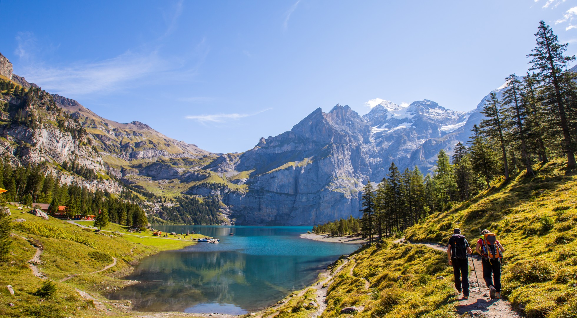 Tourist in summer view over the Oeschinensee (Oeschinen lake)