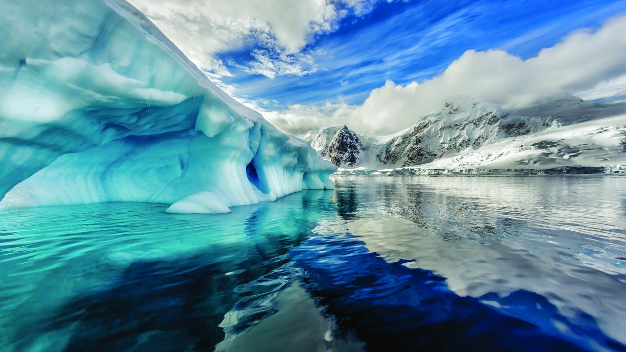 Iceberg floats in Andord Bay on Graham Land, Antarctica.