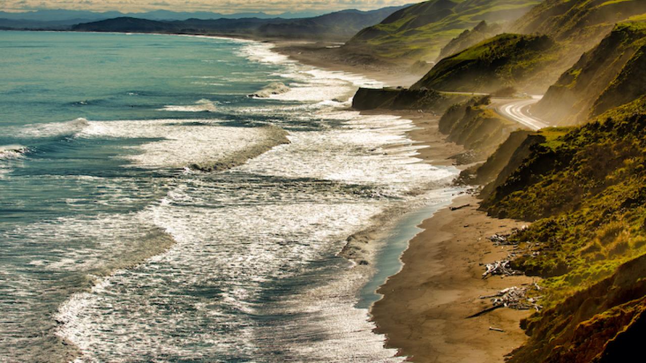 The spray from the crashing waves hitting the coastal road off the Gisborne Coast