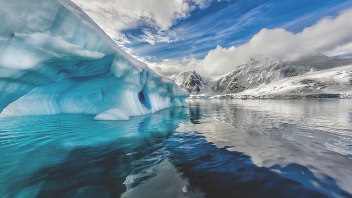 Iceberg floats in Andord Bay on Graham Land, Antarctica.